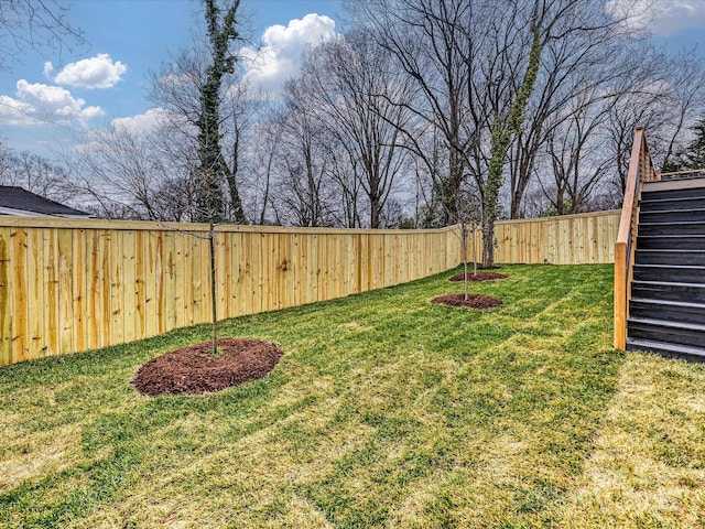 view of yard featuring a fenced backyard