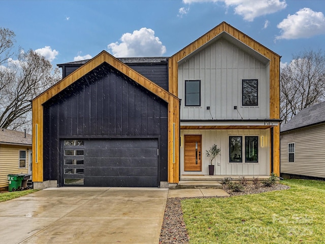 view of front of home with a garage, board and batten siding, driveway, and a porch