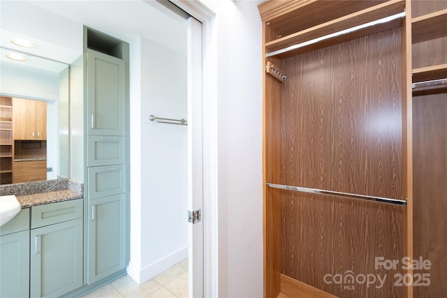 interior space with tile patterned flooring and vanity