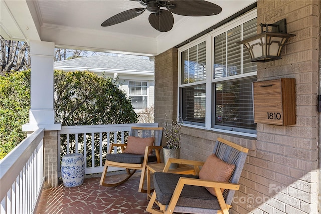 balcony featuring covered porch and ceiling fan