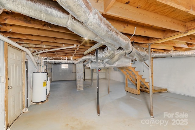 unfinished basement featuring electric water heater