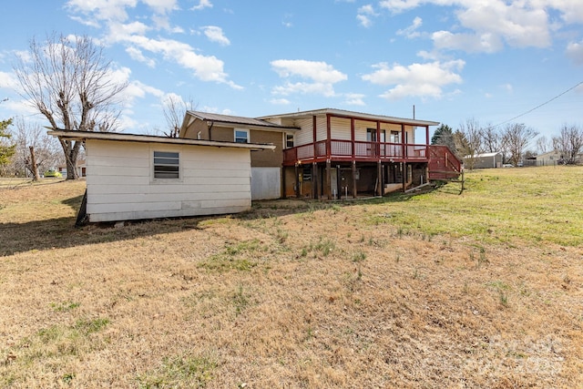 back of house with a yard and a deck