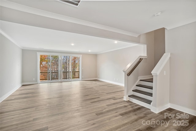 interior space with crown molding and light wood-type flooring