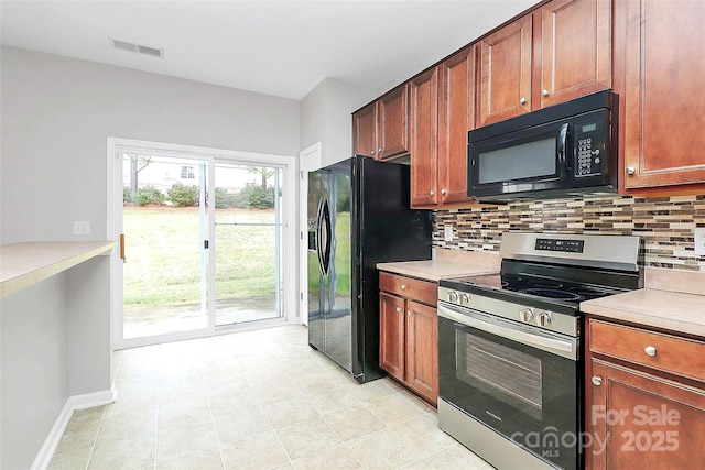 kitchen featuring tasteful backsplash and black appliances