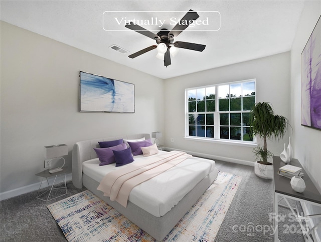 carpeted bedroom with ceiling fan