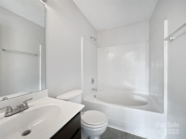 full bathroom with shower / washtub combination, tile patterned flooring, vanity, toilet, and a textured ceiling