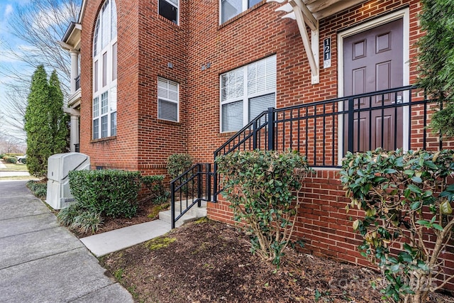 entrance to property with brick siding