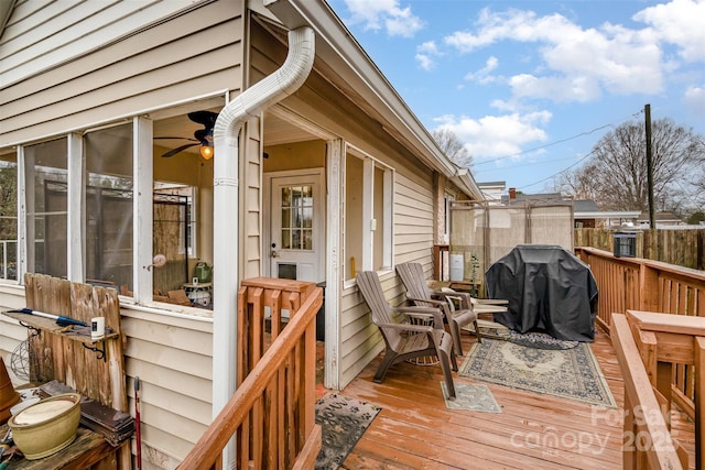 wooden terrace with a grill