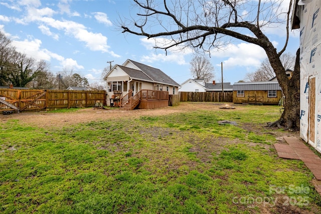 view of yard featuring a wooden deck