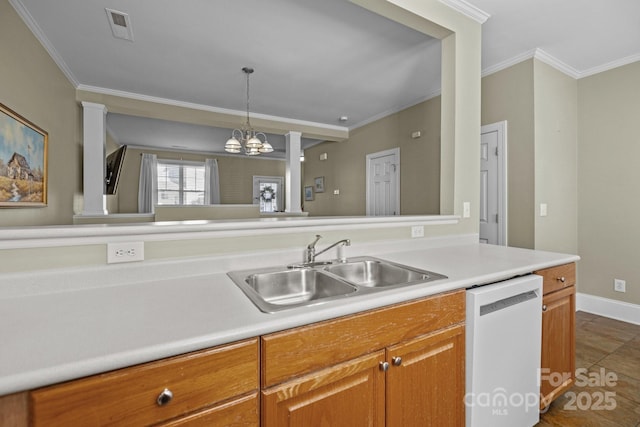 kitchen featuring dishwashing machine, a sink, visible vents, light countertops, and ornamental molding