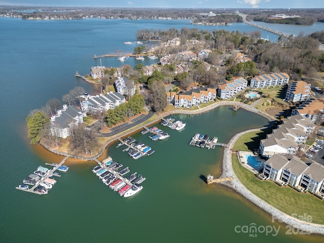 birds eye view of property with a water view and a residential view