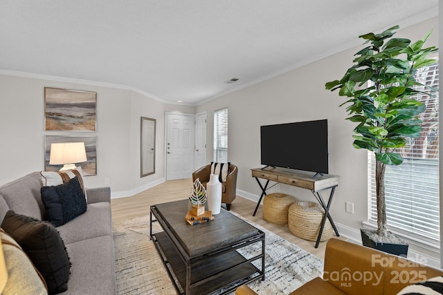 living room featuring ornamental molding and light hardwood / wood-style floors