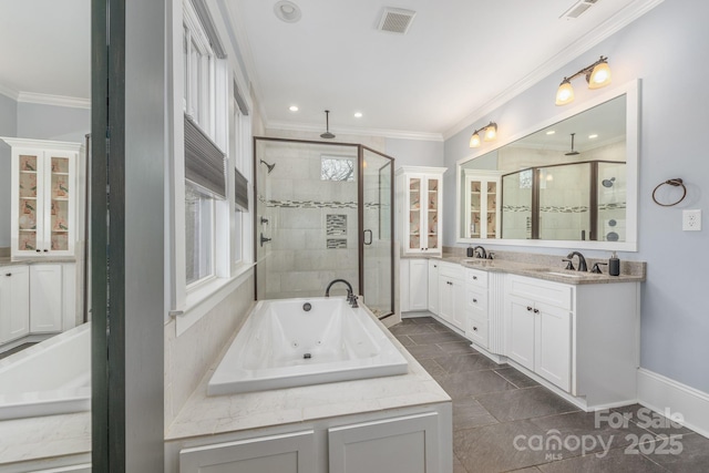 bathroom with vanity, ornamental molding, and separate shower and tub