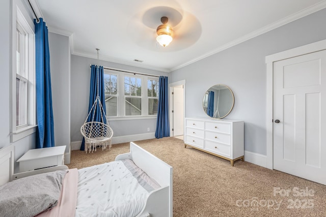 bedroom with ceiling fan, ornamental molding, and carpet floors