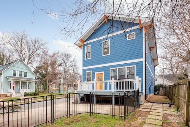 rear view of property with a deck