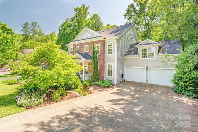 view of front of property with a porch, driveway, brick siding, and a garage