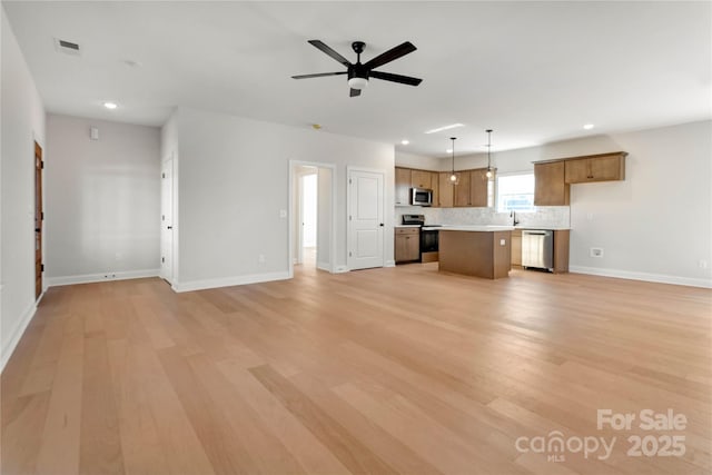 unfurnished living room featuring ceiling fan, light wood-type flooring, visible vents, and recessed lighting