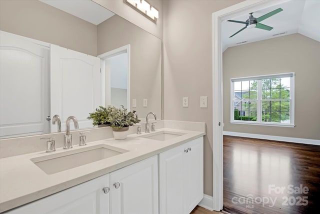 409 Running Horse Ln, Waxhaw, NC 28173 - bathroom with a ceiling fan, lofted ceiling, double vanity, and wood finished floors