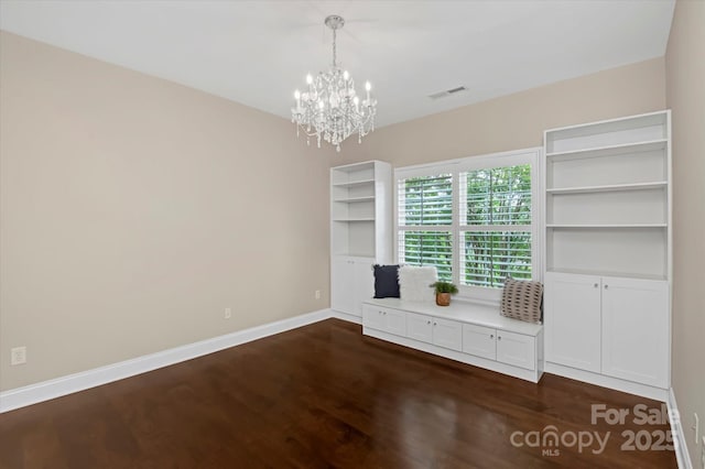 409 Running Horse Ln, Waxhaw, NC 28173 - unfurnished dining area featuring dark wood-style flooring, a chandelier, and baseboards