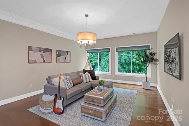 409 Running Horse Ln, Waxhaw, NC 28173 - living area with plenty of natural light, wood finished floors, baseboards, and crown molding