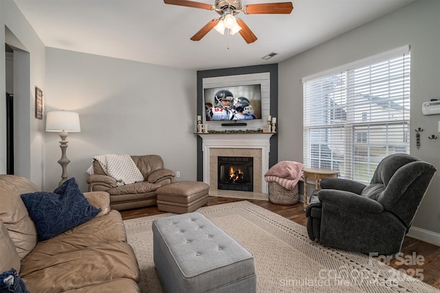 living room with hardwood / wood-style floors and ceiling fan