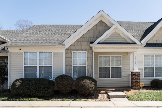 view of front facade with a shingled roof