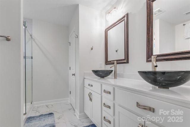 bathroom with vanity and walk in shower