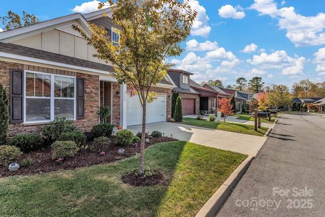 view of front of property featuring a garage and a front lawn