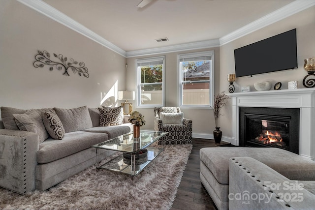 living room with crown molding and dark wood-type flooring