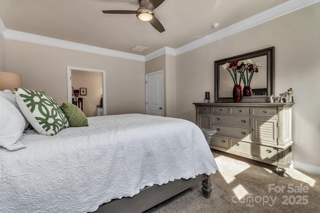 carpeted bedroom featuring ceiling fan and ornamental molding