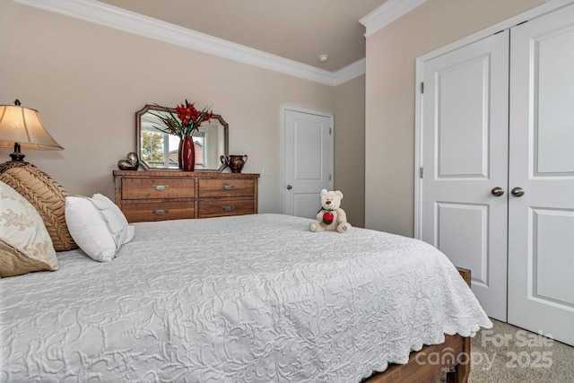 bedroom featuring ornamental molding, a closet, and carpet