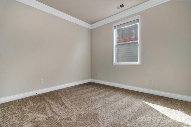 carpeted spare room with ornamental molding