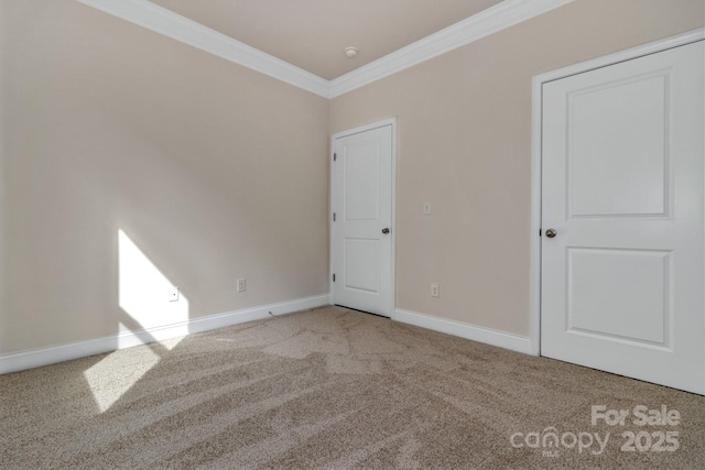 carpeted spare room with ornamental molding