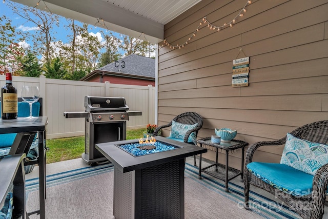 view of patio / terrace featuring a grill and a fire pit