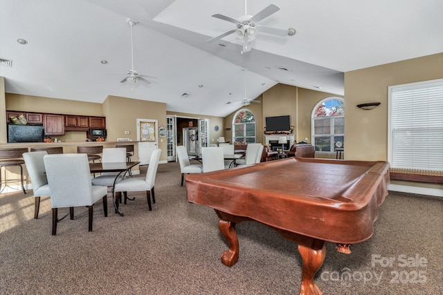 recreation room with pool table, high vaulted ceiling, ceiling fan, and carpet