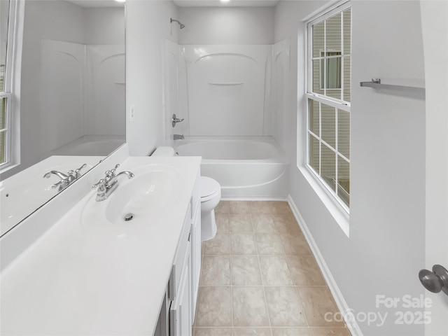 full bath with shower / bath combination, baseboards, toilet, tile patterned floors, and vanity