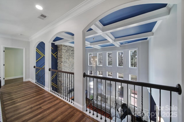 hall featuring dark wood-style flooring, visible vents, coffered ceiling, beamed ceiling, and baseboards