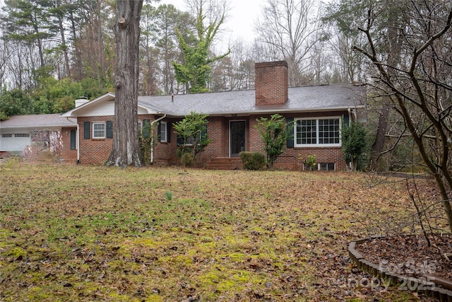 single story home featuring a front yard, brick siding, and a chimney