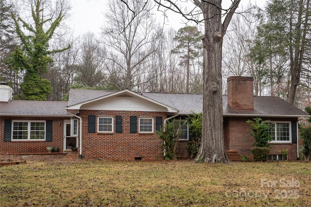 ranch-style house with brick siding, a front lawn, roof with shingles, a chimney, and crawl space