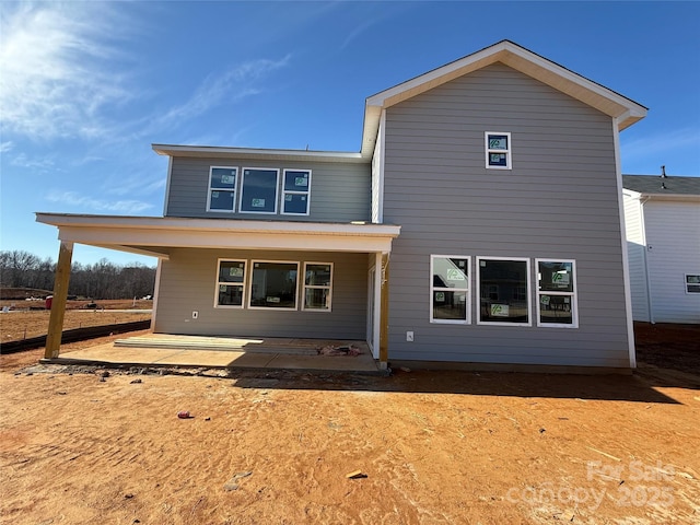 rear view of house featuring a patio