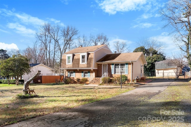 split level home with a front yard