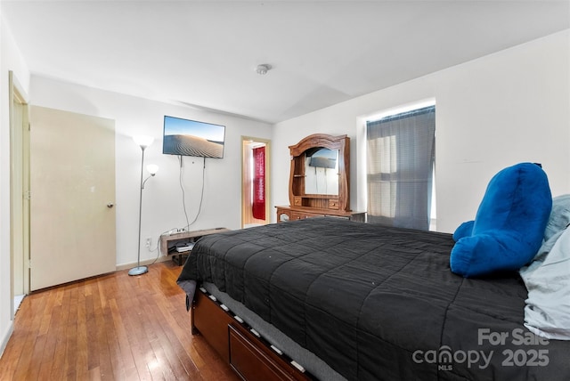 bedroom featuring wood-type flooring