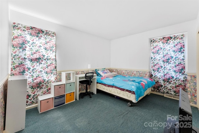 bedroom featuring dark colored carpet