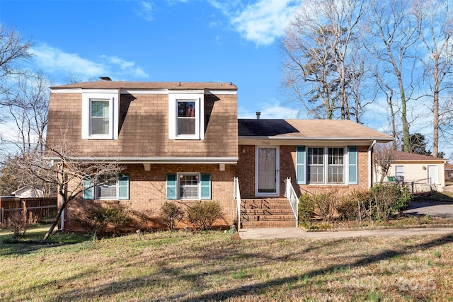 view of front of home with a front lawn