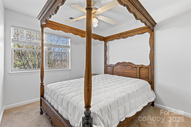 carpeted bedroom with a ceiling fan and baseboards