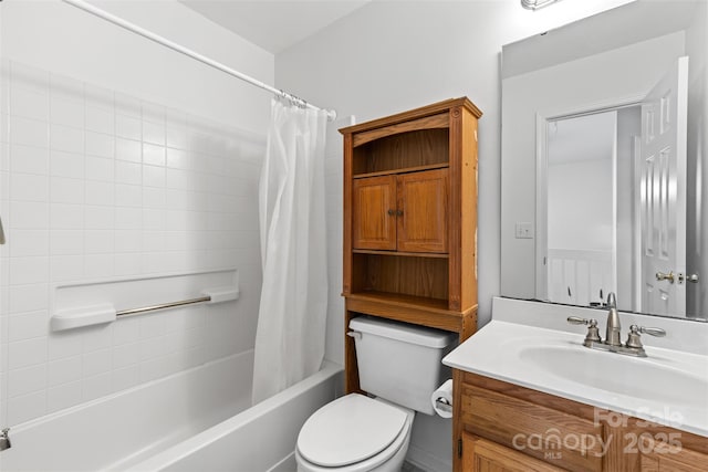 full bathroom with vanity, shower / tub combo, and toilet