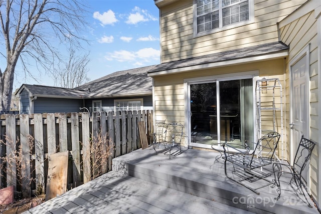 wooden deck featuring fence