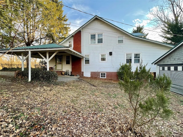 back of property with a patio