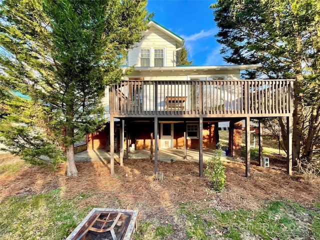 back of house featuring a deck