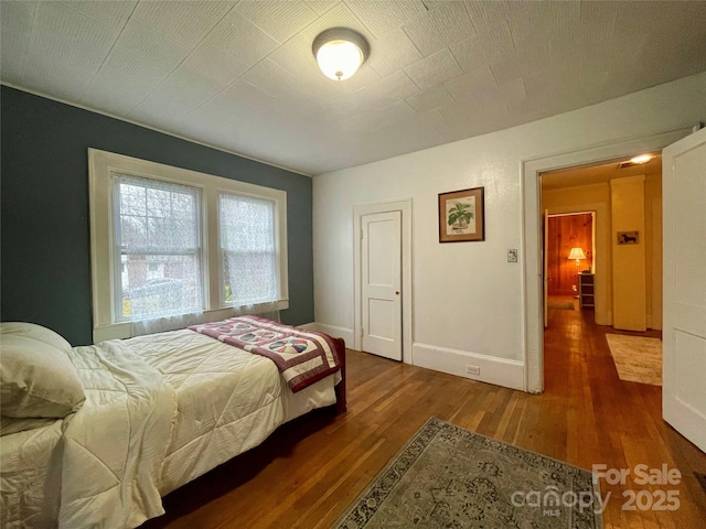 bedroom featuring hardwood / wood-style floors